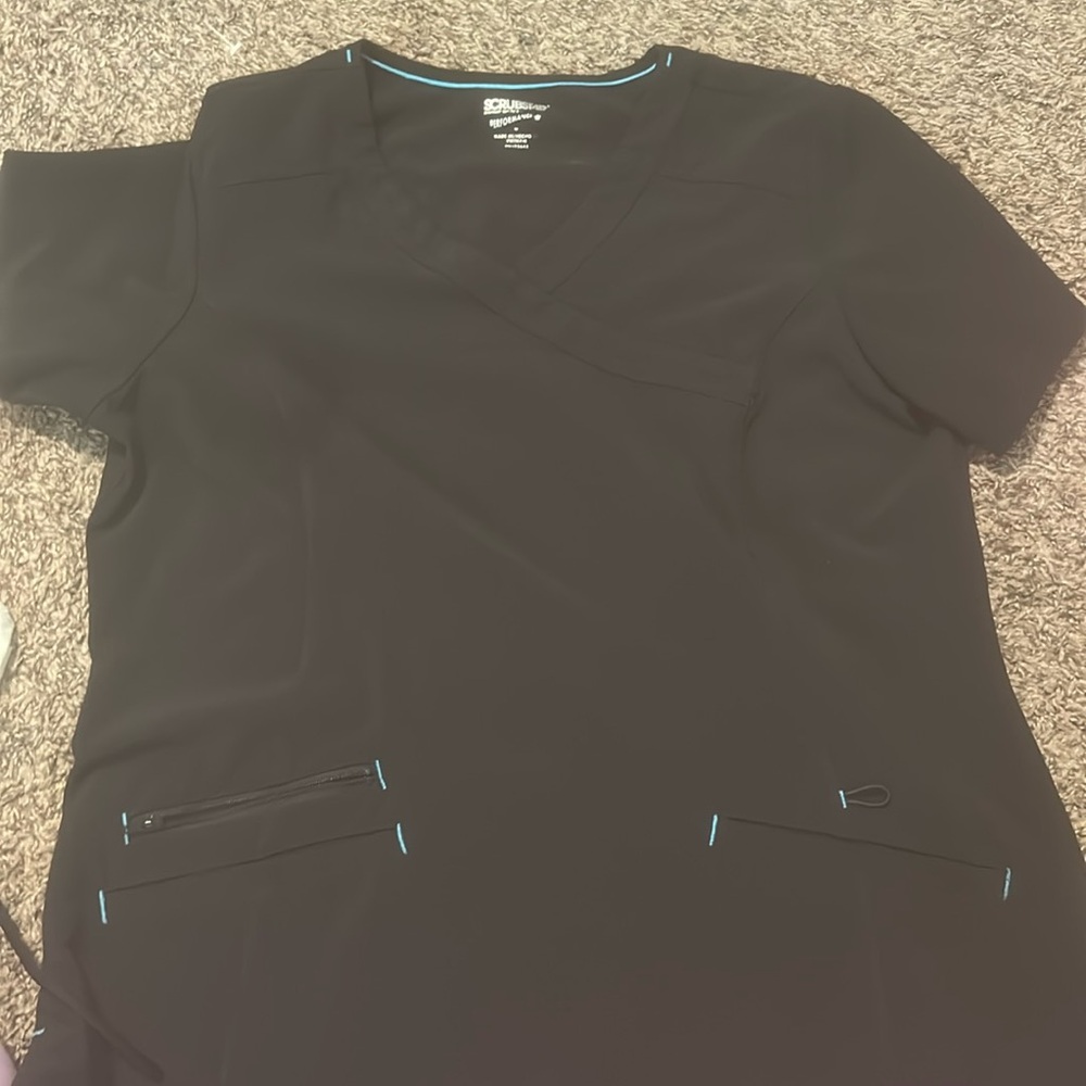 Black scrub top. Size M